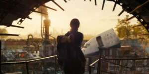 a-female-character-looking-outside-in-fallout